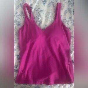 Sonic pink lululemon align waist length tank.